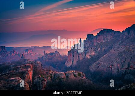 Beautiful nightfall painting the sky over the oddly shaped sandstone rocks in the epic town of  Belogradchik, northwest Bulgaria Stock Photo