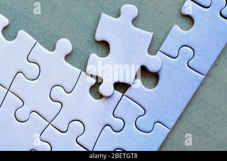 Connected pieces of one-color puzzle. Closeup. Stock Photo