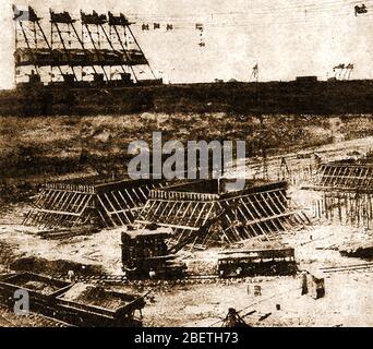 An early printed photograph showing the building of the Panama Canal  - Transporting large amounts of concrete to the site. Stock Photo