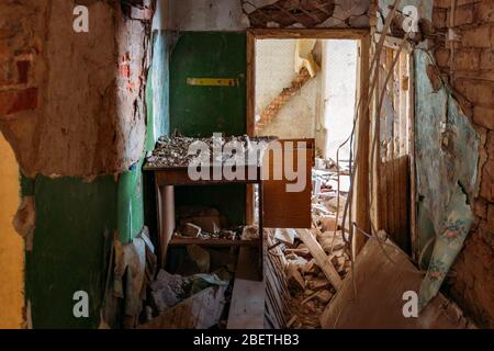Interior of the ruined collapsed abandoned house. Stock Photo