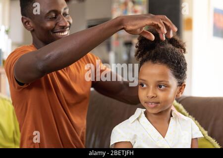 Father and Daughter social distancing at home during quarantine lockdown Stock Photo