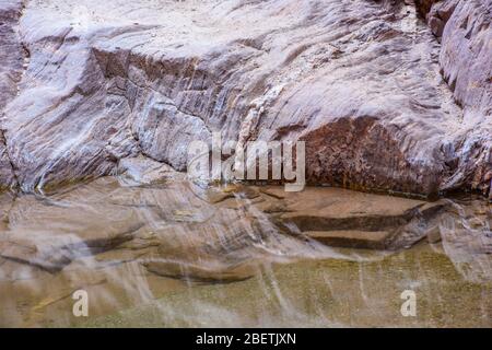 Water stained rocks and reflecting pools in Blacktail Canyon, Grand Canyon National Park, Arizona, USA Stock Photo