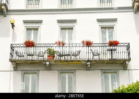 LAKE COMO, ITALY - JUNE 2019: Exterior view of a balcony on the front of the Grand Hotel Cadenabbia on Lake Como. Stock Photo