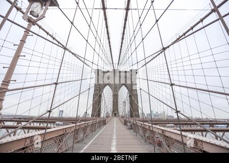 New York, United States. 15th Apr, 2020. Brooklyn Bridge is seen empty in New York City in the United States. New York City is the epicenter of the Coronavirus pandemic (COVID-19). Credit: Brazil Photo Press/Alamy Live News Stock Photo