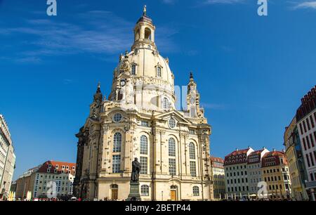 Statue of Martin Luther in front of famous lutheran church of Our Lady Frauenkirche on the central city square in Dresden, Germany Stock Photo