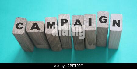 CAMPAIGN word made with building blocks. Marketing advertising smm targeting business concept Stock Photo