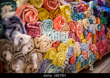 folded rolls of towels bed linen Galata Turkish Bazaar fabric Stock Photo