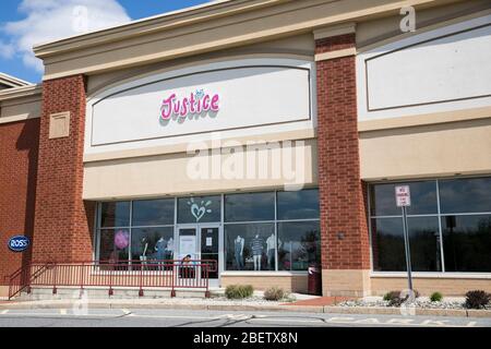 A logo sign outside of a Justice retail store location in Mays Landing, New Jersey on April 11, 2020. Stock Photo