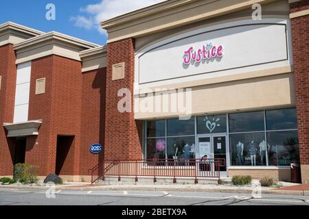 A logo sign outside of a Justice retail store location in Mays Landing, New Jersey on April 11, 2020. Stock Photo