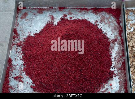 Close up of intense red-colored saffron powder  on a tray Stock Photo