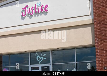 A logo sign outside of a Justice retail store location in Mays Landing, New Jersey on April 11, 2020. Stock Photo