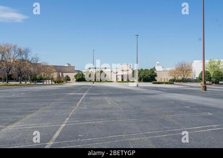Kennesaw, GA / USA - 04/03/20: Empty parking lots - temporary shut down at Cobb county Town Center mall due to economic crisis during Covid-19 Corona Stock Photo