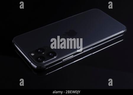 Galati, Romania, March 23, 2020: New iphone 11 Pro Max. iPhone 11 Pro is a smartphone developed by Apple Inc. Space gray smartphone back view on black Stock Photo