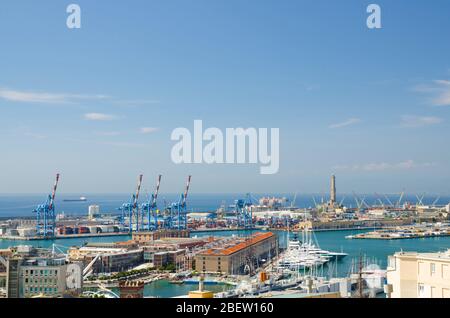 Top aerial scenic panoramic view of old Port with Lighthouse La Lanterna di Genova, terminals, warehouses, cranes and harbor of Ligurian and Mediterra Stock Photo