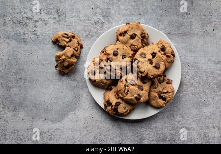 Plate of freshly baked chocolate chip cookies shot from above. Stock Photo