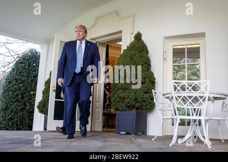 Washington, United States. 15th Apr, 2020. President Donald Trump leaves the Oval Office as he makes his way to the Rose Garden to deliver remarks on the COVID-19 pandemic at the White House in Washington, DC, on Wednesday, April 15, 2020. Photo by Shawn Thew/UPI Credit: UPI/Alamy Live News Stock Photo