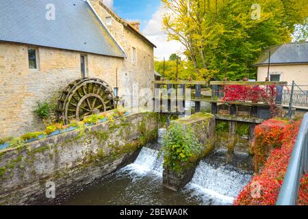 The water mill on the River Aure in the medieval town of Bayeux on the Normandy Coast of France, with bold autumn colors Stock Photo