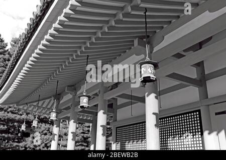 A row of hanging outdoor lanterns under a traditional roof in the Heian Shrine in Kyoto, Japan. Stock Photo