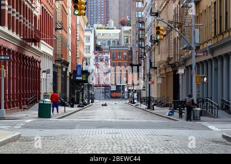 Corner of Mercer Street and Grand St in the SoHo neighborhood of Manhattan. Mercer St features a cobblestone street. Stock Photo