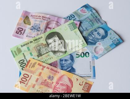 Money in banknotes or bills, Mexican money on a white surface, Mexican pesos or billets en pesos. Stock Photo