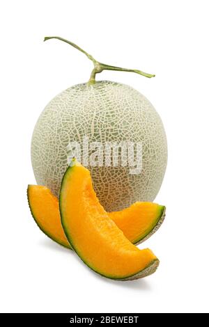 Organic japanese cantaloup melon and sliced on white isolated background with clipping path. Ripe orange cantaloup melon have sweet taste and juicy fo Stock Photo