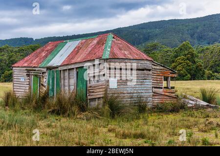 An abandoned weatherboard and corrugated iron, pioneer barn house or ...