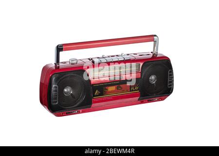 Vintage radio cassette recorder isolated over white background. Old retro red radio and cassette player. retro technology