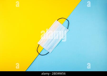 Download One Medical Mask On A Yellow Background Stock Photo Alamy PSD Mockup Templates