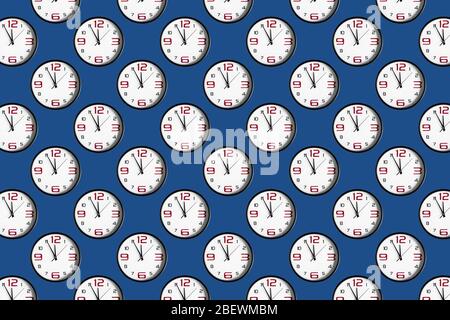 Seamless pattern with clocks on a classic blue background. black and white round classic wall clock. Stock Photo