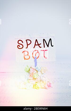 Handwriting text writing Spam Bot. Conceptual photo autonomous program on the Internet that sends spam to users Reminder pile colored crumpled paper c Stock Photo