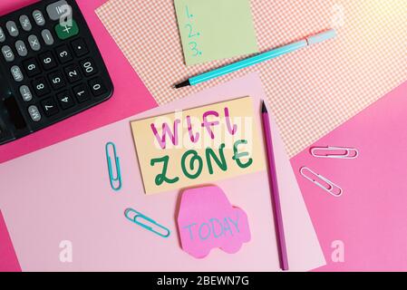 Conceptual hand writing showing Wifi Zone. Concept meaning provide wireless highspeed Internet and network connections writing equipments and plain no Stock Photo