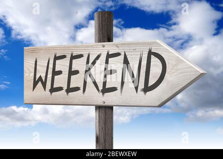 Weekend - wooden signpost with one arrow Stock Photo - Alamy