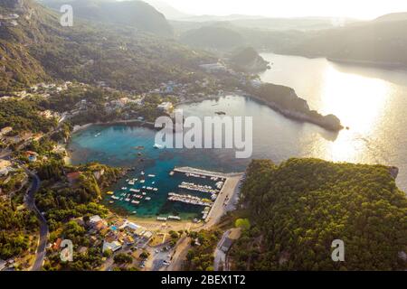 Aerial view on Paleokastritsa harbour in Greece. Boats in Alipa port in the morning. Greece travelling destination. Landscape of Corfu Stock Photo