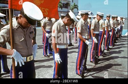 1982 - A Marine Corps honor guard waits for Secretary of Defense Caspar W. Weinberger to arrive at Arthur W. Radford Field for a visit. Stock Photo