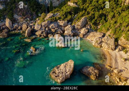 Aerial shot of a lagoon in mediterranean sea. Beautiful torquoise ocean water. Greece coast from a drone Stock Photo