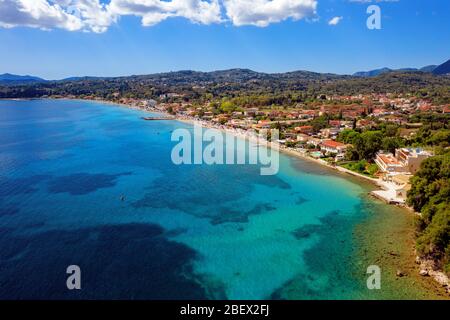 Aerial lanscape of mediterranean village on a sea shore. Kato Agios Markos resort in Greece, Corfu island. Sunny day on a beach Stock Photo