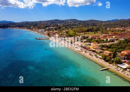 Beautiful long mediterranean beach in Greece aerial. A greek resort on Corfu island. Stock Photo