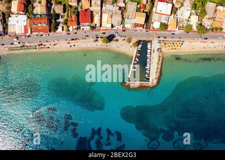 Beautiful mediterranean beach shot from a drone. Resort in Greece on a sea shore. Greek travel destination Stock Photo