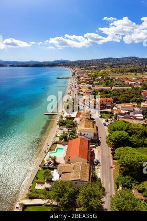 Aerial of mediterranean shore village in Greece. Dassia resort on Corfu island. Beautiful village in summer Stock Photo