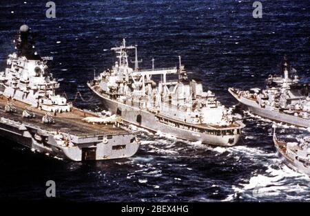 1982 - A port quarter view of the Soviet Keila class transport ship BEREZINA, center, replenishing three warships while underway. Stock Photo