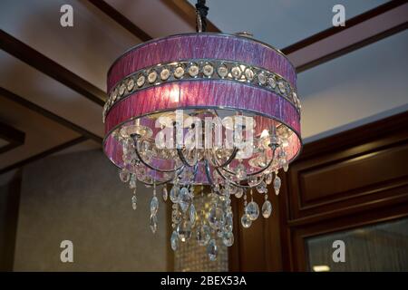 Hanging Lights with Creme Fabric Shade. Modern 3-Light Led pink Chandelier. Pendant Sconce Lighting Lamp . Ceiling Light Oval Pendant Light Fixture. Stock Photo