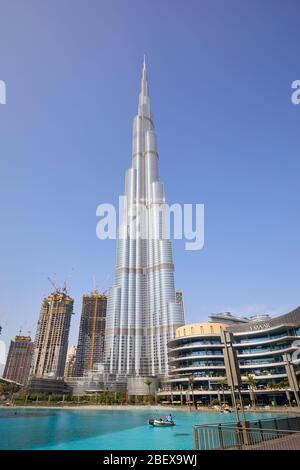 DUBAI, UNITED ARAB EMIRATES - NOVEMBER 19, 2019: Burj Khalifa skyscraper and Dubai Mall in a clear sunny day low angle view Stock Photo