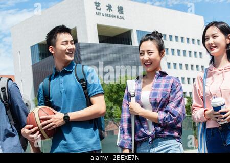 Happiness of college students walking in the campus Stock Photo