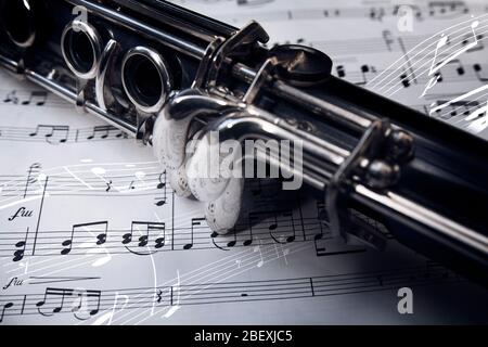 Close up of a clarinet laying on sheet music Stock Photo