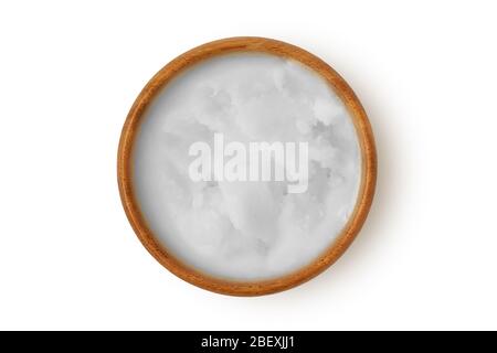 Coconut oil in wooden bowl on white background Stock Photo