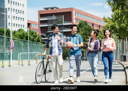 Happiness of college students walking in the campus Stock Photo
