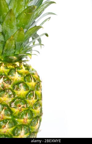 A whole pineapple against a plain white background Stock Photo