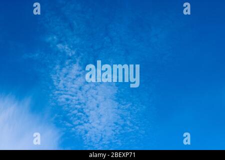 Cirrocumulus clouds in the blue sky. Natural background with copy space for text. Stock Photo