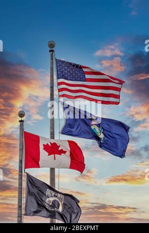 American Maine Canadian and POW Flags at Sunset Stock Photo