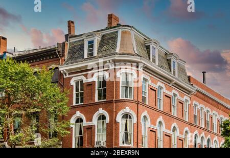 Classic Two Story Brick Building at Dusk Stock Photo